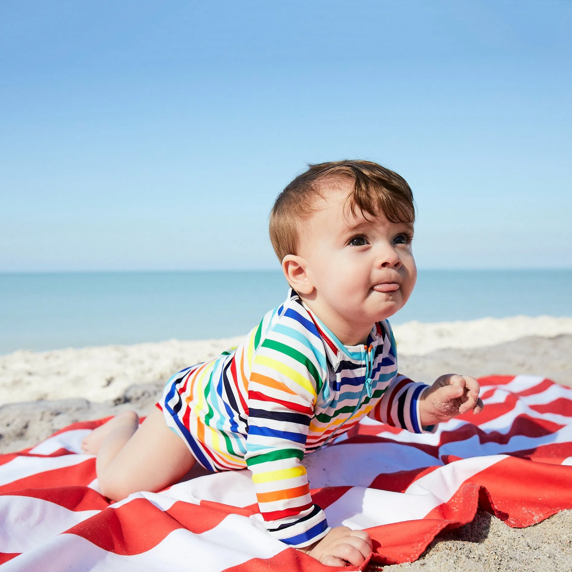 Baby one-piece rash guard in rainbow stripe