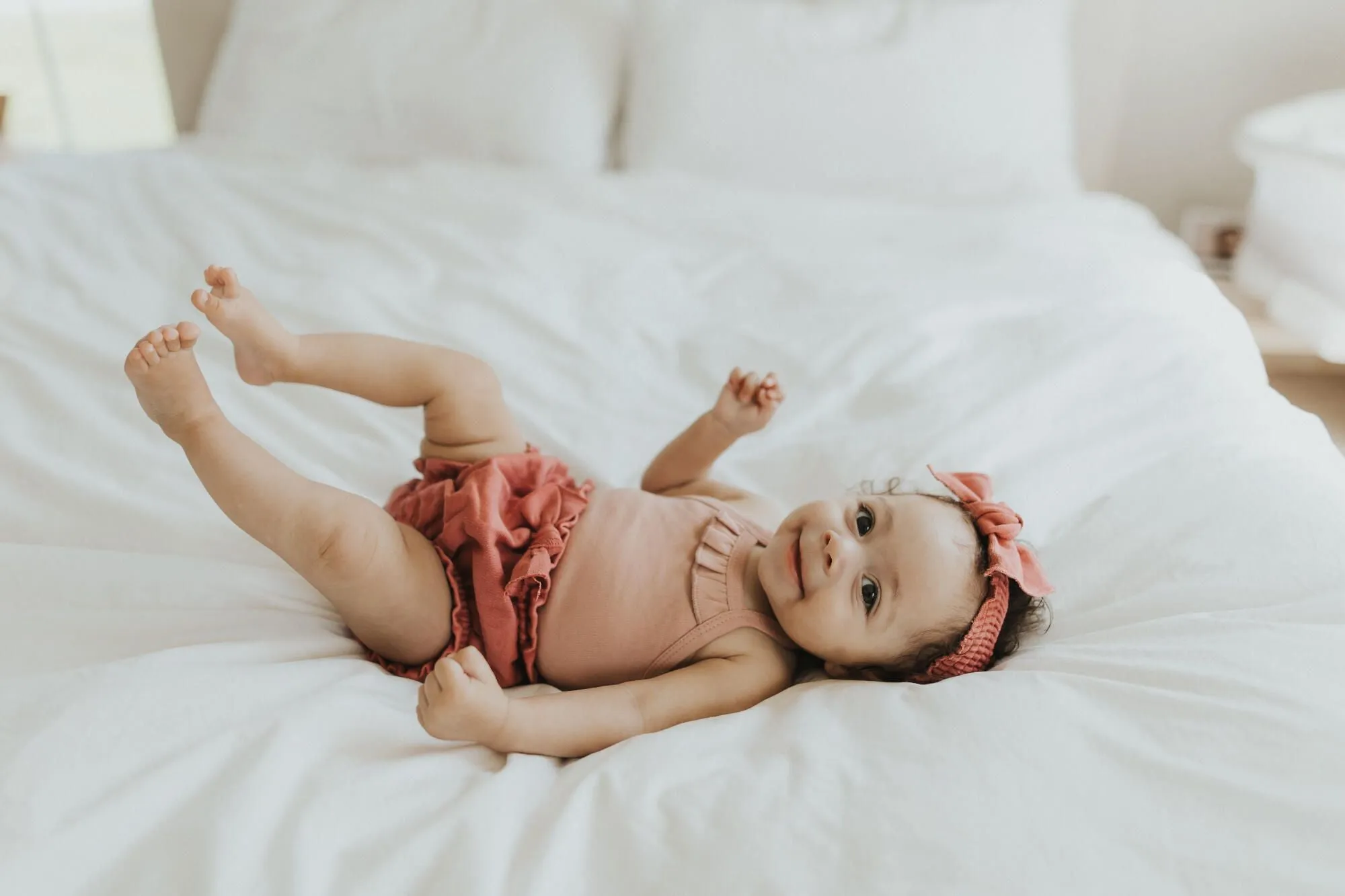 Mauve Ruffle Criss-cross Bodysuit